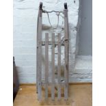 A vintage sled with metal bound runners,