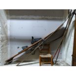 A pair of vintage wooden skis and bamboo poles,