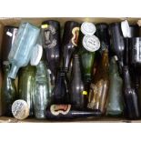 A collection of old beer bottles including Cheltenham & Hereford Brewery and assorted ceramic pot