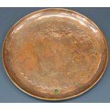 Newlyn hammered copper plate with incised border, stamped 'Newlyn' to the centre, 20cm in diameter.