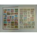A box containing a large collection of stamps from Thailand in five stockbooks and a folder,