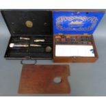 A vintage Winsor and Newton artist's box and a Winsor and Newton metal box with palette and paints