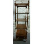 An elm five tier what-not with single drawer raised on turned legs,