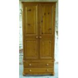 A pine wardrobe with two drawers,