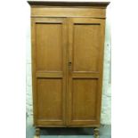 A 19thC light oak and elm cupboard with four shelves raised on turned legs,