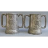 A pair of pewter loving cup trophies with Eton College coat of arms,