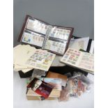 A box of GB, Commonwealth and foreign stamps, mainly on loose album pages,