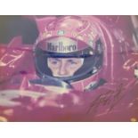 Michael Schumacher signed photograph with certificate of authenticity, framed and glazed, 38 x 50cm.