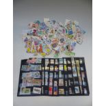 A collection of Rumanian stamps and general collection in a ring binder and a themed collection of