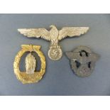 Nazi German cap badge and two similar style badges