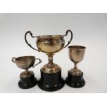 Three Worcestershire Regiment and other interest trophy cups to include hallmarked silver example