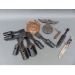 A quantity of Nazi German reproduction insignia including Hitler Youth knife and copper fire or