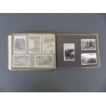 A WWII Nazi German Luftwaffe photograph album including group photo, vehicles, shot down aircraft,