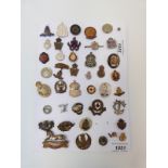 A collection of military badges including sweetheart, Home Guard,