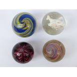 Four large handmade glass marbles including a fox Sulphide cameo example,