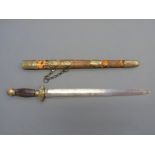 A 19thC Chinese brass mounted short sword with striated horn handle,