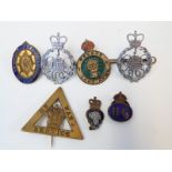 WWI On War Service badge numbered 153497, two GCHQ police badges, Women's Land Army,