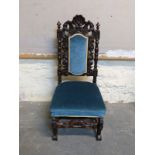 A mid to late Victorian carved nursing / hall chair