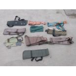 Ten various gun slips / cases, some leather and some padded.