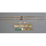 Three longbows, two DG Quick and one Pladfinder Wings together with a collection of Hornet arrows,