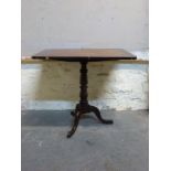A19thC mahogany tilt top table with cross banded decoration to top, raised on tripod base,