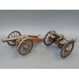 Two brass and wood model cannon, one marked Gatling USA 1885, the other with Russian Imperial crest,