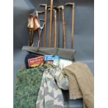 A collection of horn mounted sticks, spade, shooting seats, books on shooting,
