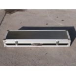 A hard gun flight case with padded interior, 110x30x14cm.