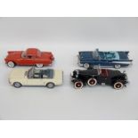 Five Danbury Mint diecast model cars comprising 1966 Ford Mustang, 1956 Ford Thunderbird,