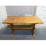 A pine refectory or kitchen table,