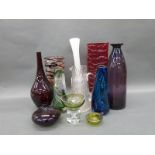 A collection of coloured glassware including Whitefriars,