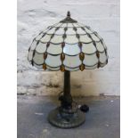 A Tiffany style table lamp and a further gilt example with geometric glass shade,