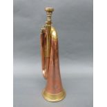 A military brass and copper bugle manufactured by Besson,