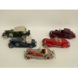 Five Danbury Mint diecast model cars comprising 1932 Cadillac V-16, 1934 Packard V-12,