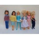 Six Sindy dolls, all in various outfits and with different hairstyles,