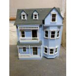 A dormered doll's house in the colonial American style architecture,