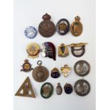 A collection of military enamel and other badges to include Worcestershire Old Comrades and Rats of