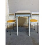 A retro Formica kitchen table with drop leaves