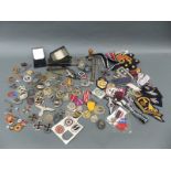 A quantity of WWII reproduction Nazi and other insignia and medals etc