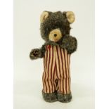 A Japanese clockwork tin-plate model bear, 17cm tall.