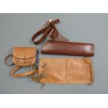 Two leather quivers and a tooled leather bag for accessories
