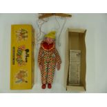 Pelham Puppets SS Clown with polka dot jump suit, red ruffle and yellow hat and grey hair,