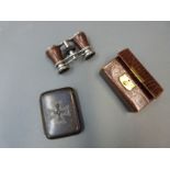 A set of opera glasses and a German military cigarette case