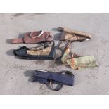 Six various gun slips / cases, some leather and some padded.