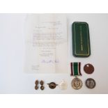 A cased Women's Voluntary Service medal,