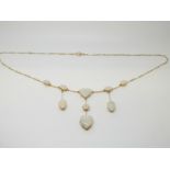 An Victorian/ Edwardian necklace set with oval, triangular and a heart shaped opal cabochons,