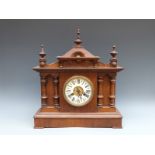 A Continental late Victorian / Edwardian oak cased two train mantel clock,