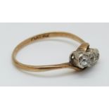 A 9ct gold ring set with three diamonds in a platinum twist setting, 2.