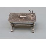 A white metal novelty codice, pens and table, marked with Medusa-Oro star and 175 AR 925,