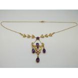 An 15ct gold Edwardian/ Art Nouveau necklace set with seed pearls and amethysts in a floral and